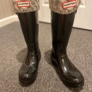 Tall black hunter boots